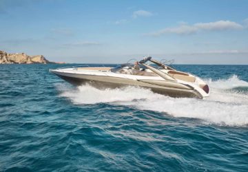 Our charter boat the Sunseeker Superhawk 48 cruising in bright blue water